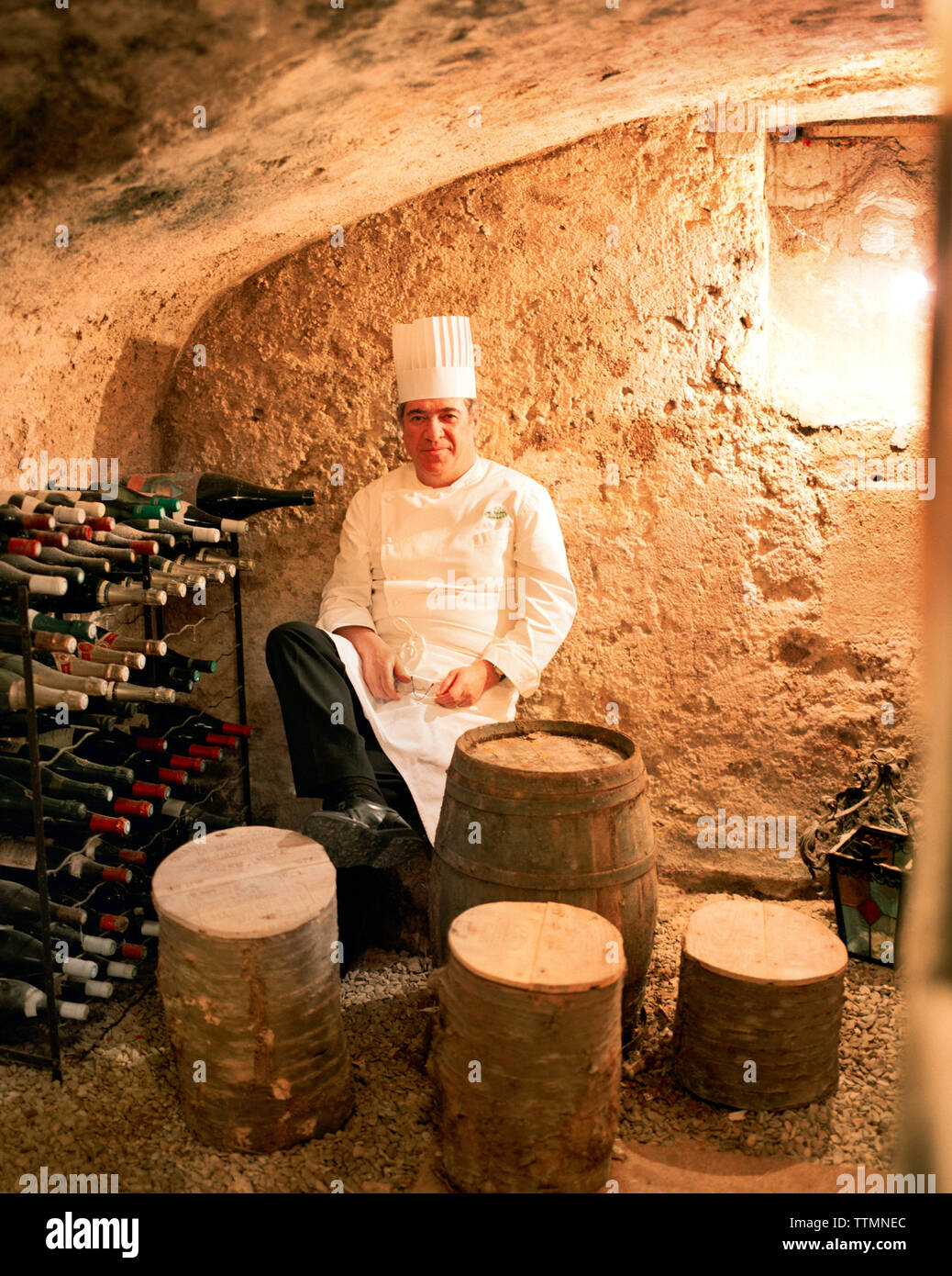 FRANCE, Auxerre, Yonne, Burgundy, portrait of chef Jean-Luc Barnabet  sitting in wine cellar at his restaurant Jean-Luc Barnabet Stock Photo -  Alamy