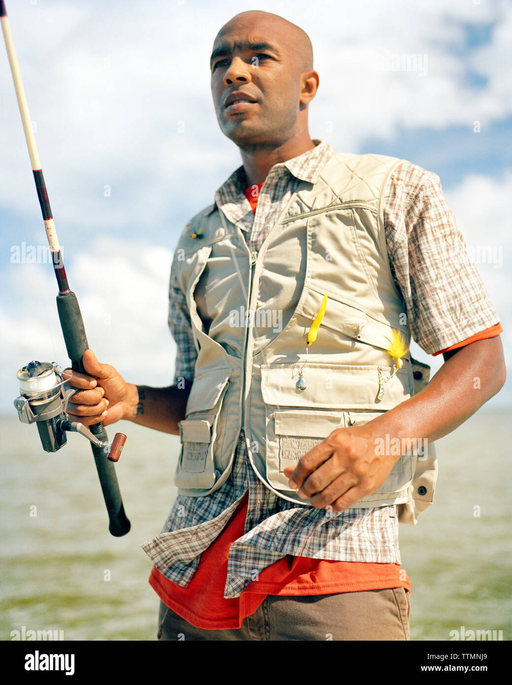 https://c8.alamy.com/comp/TTMNJ9/usa-florida-man-holding-fishing-rod-ivory-keys-TTMNJ9.jpg