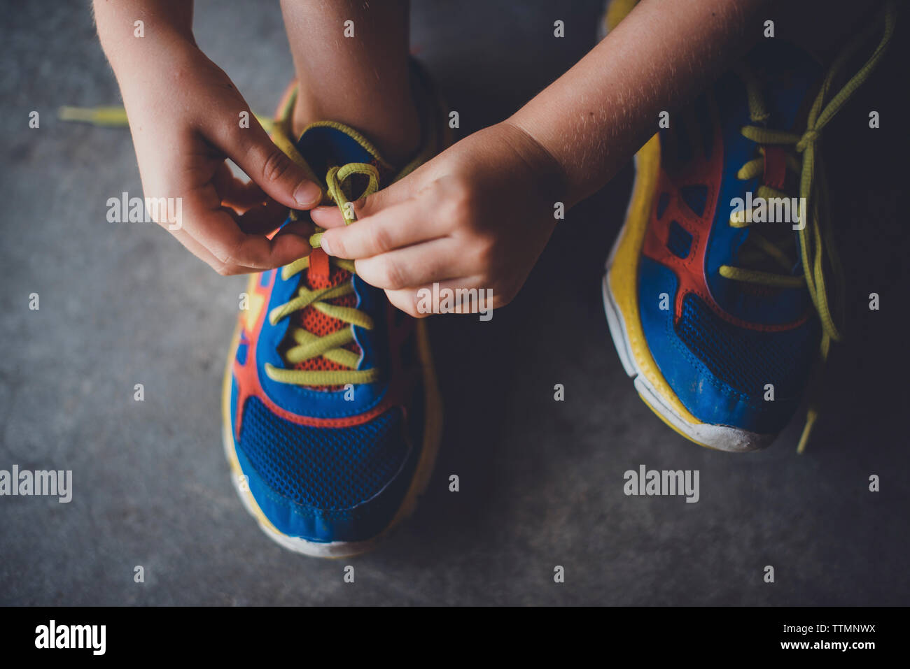 Boy tying sports shoes hires stock photography and images Alamy