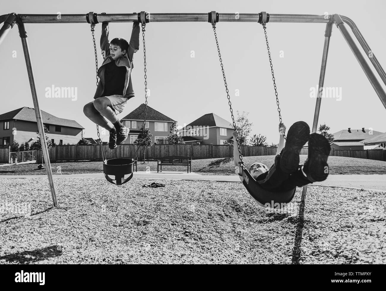 Swinging in the sky Black and White Stock Photos & Images Alamy