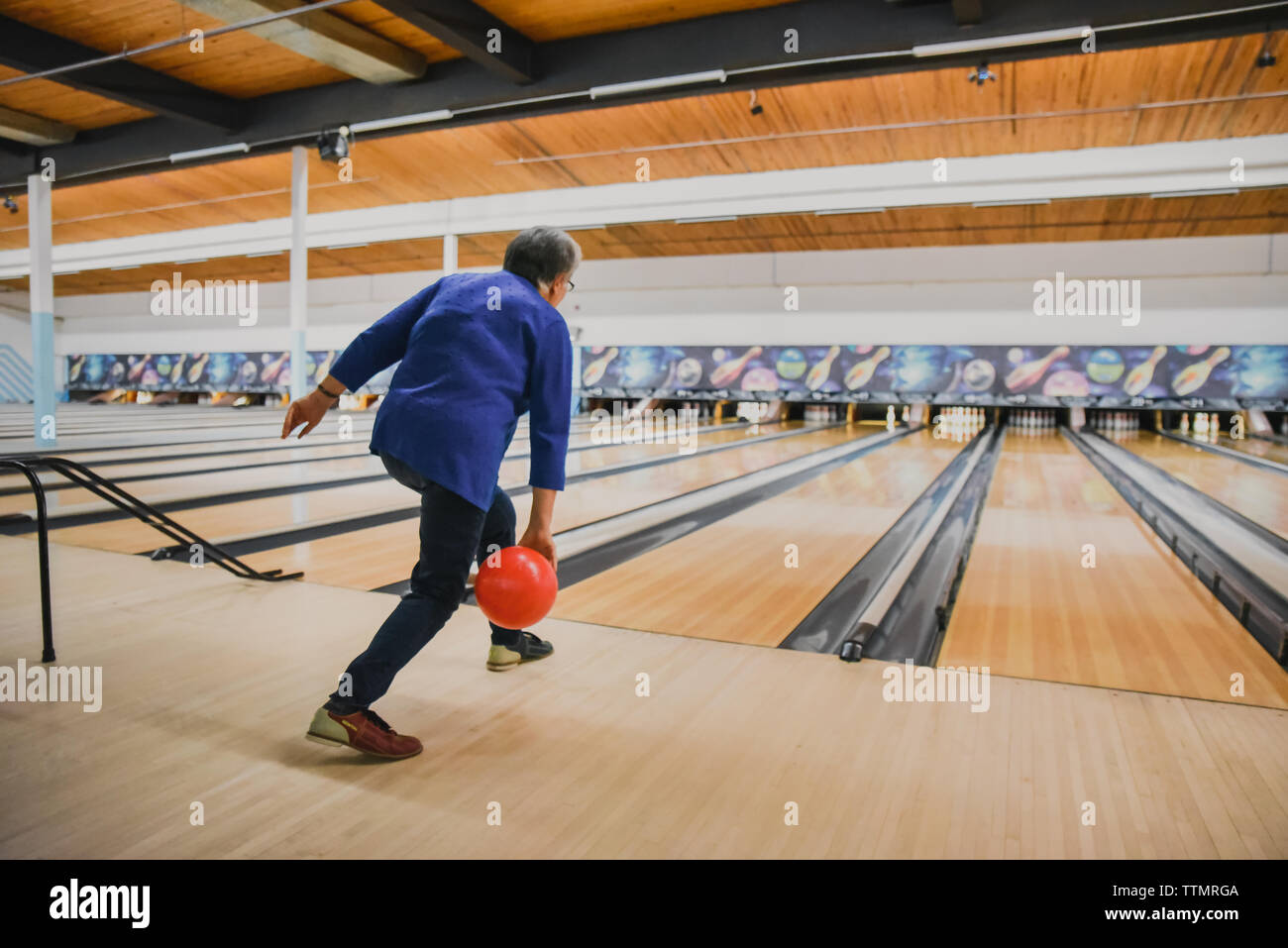 Bowling Ball Going Down Lane