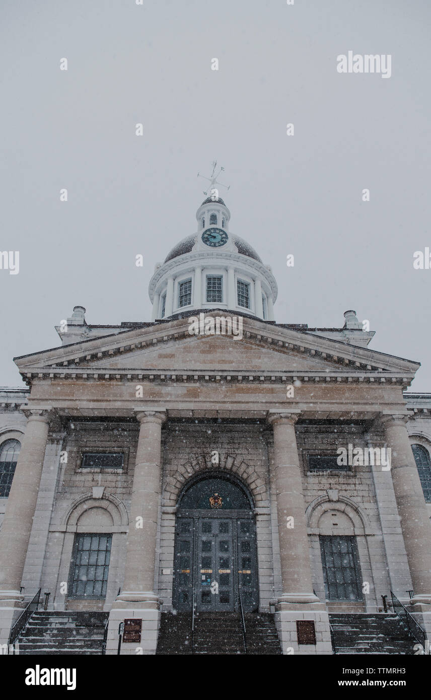 Close up front view of City Hall in Kingston, Ontario on a snowy day. Stock Photo
