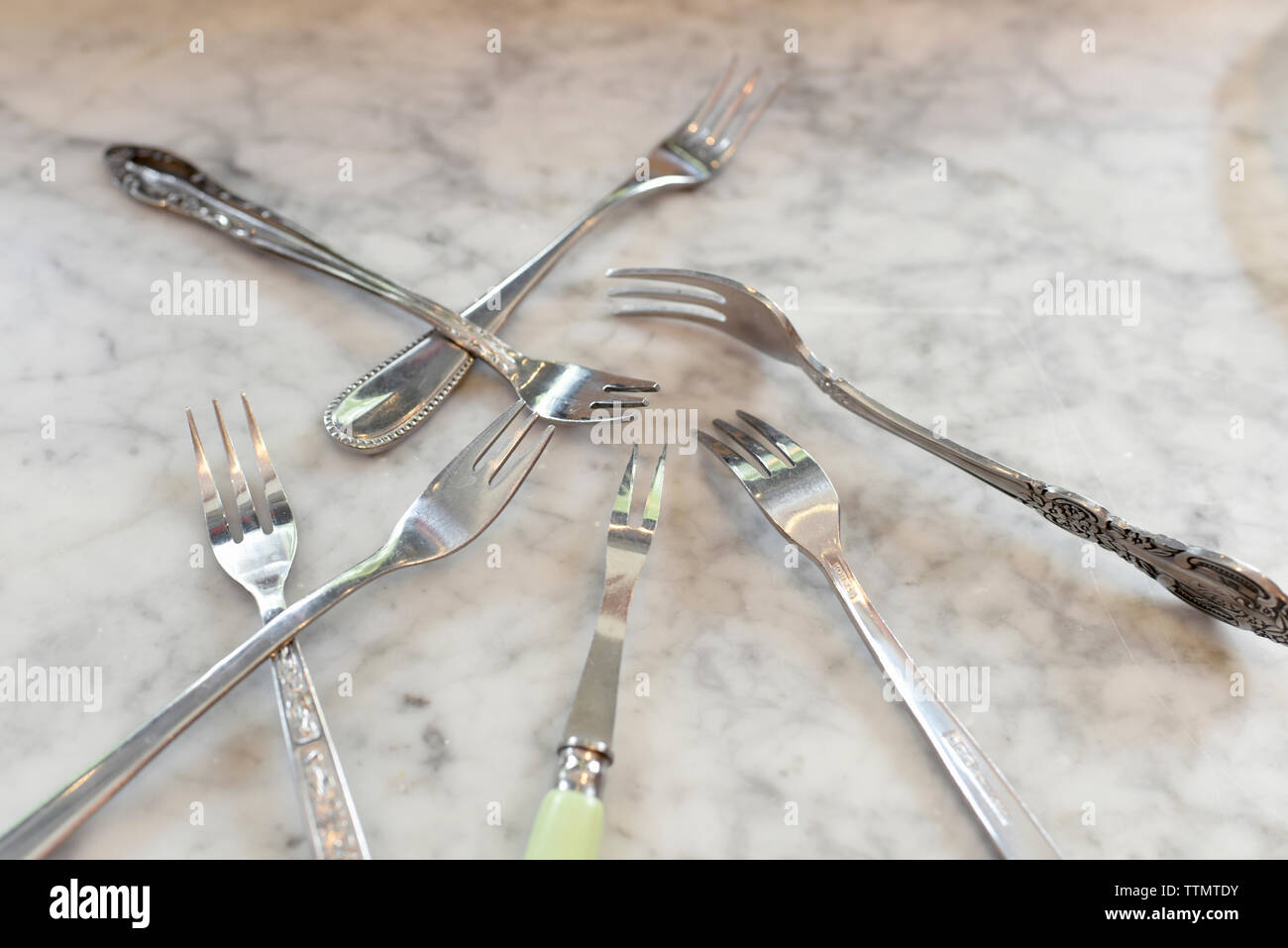 High angle view of various forks on table Stock Photo