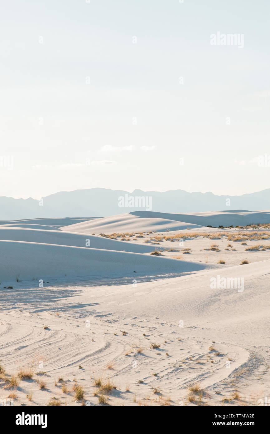 Scenic view of White Sands National Monument against sky during sunny day Stock Photo