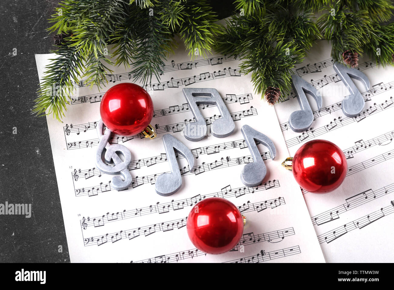 Christmas decorations on music sheets Stock Photo - Alamy