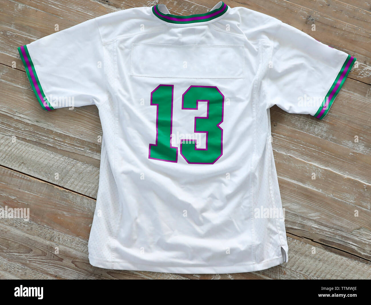 High angle view of t-shirt with number 13 on wooden table Stock Photo