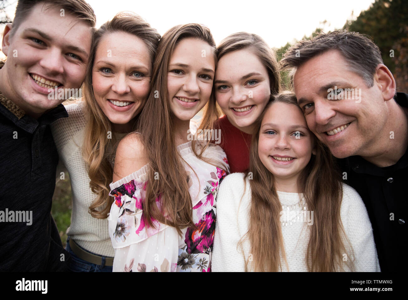 Close View of Faces of Happy Smiling Large Family of Teenagers Stock Photo