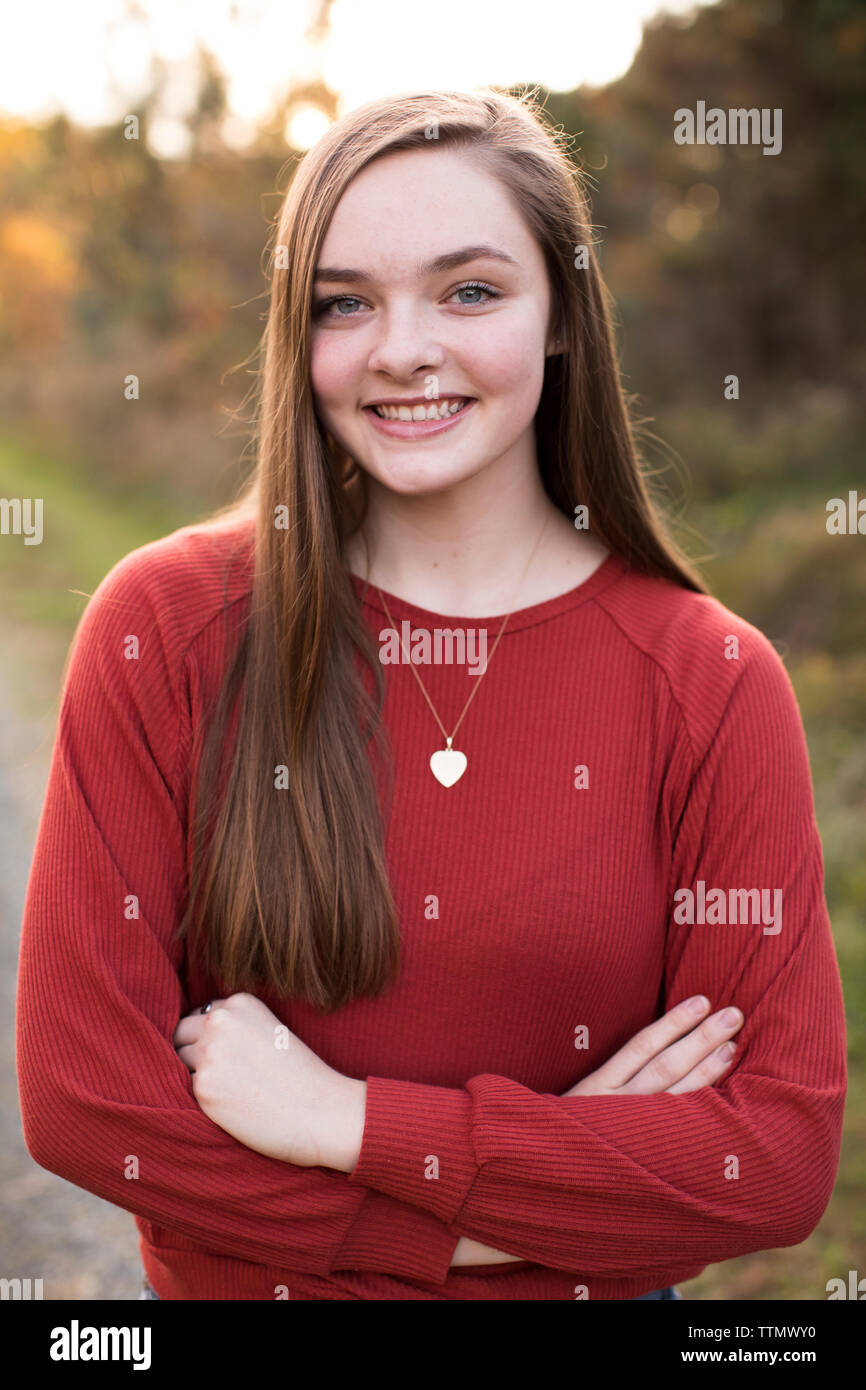 Happy, Confident, Camera Aware 18 Year Old Girl, at Sunset on Trail Stock Photo