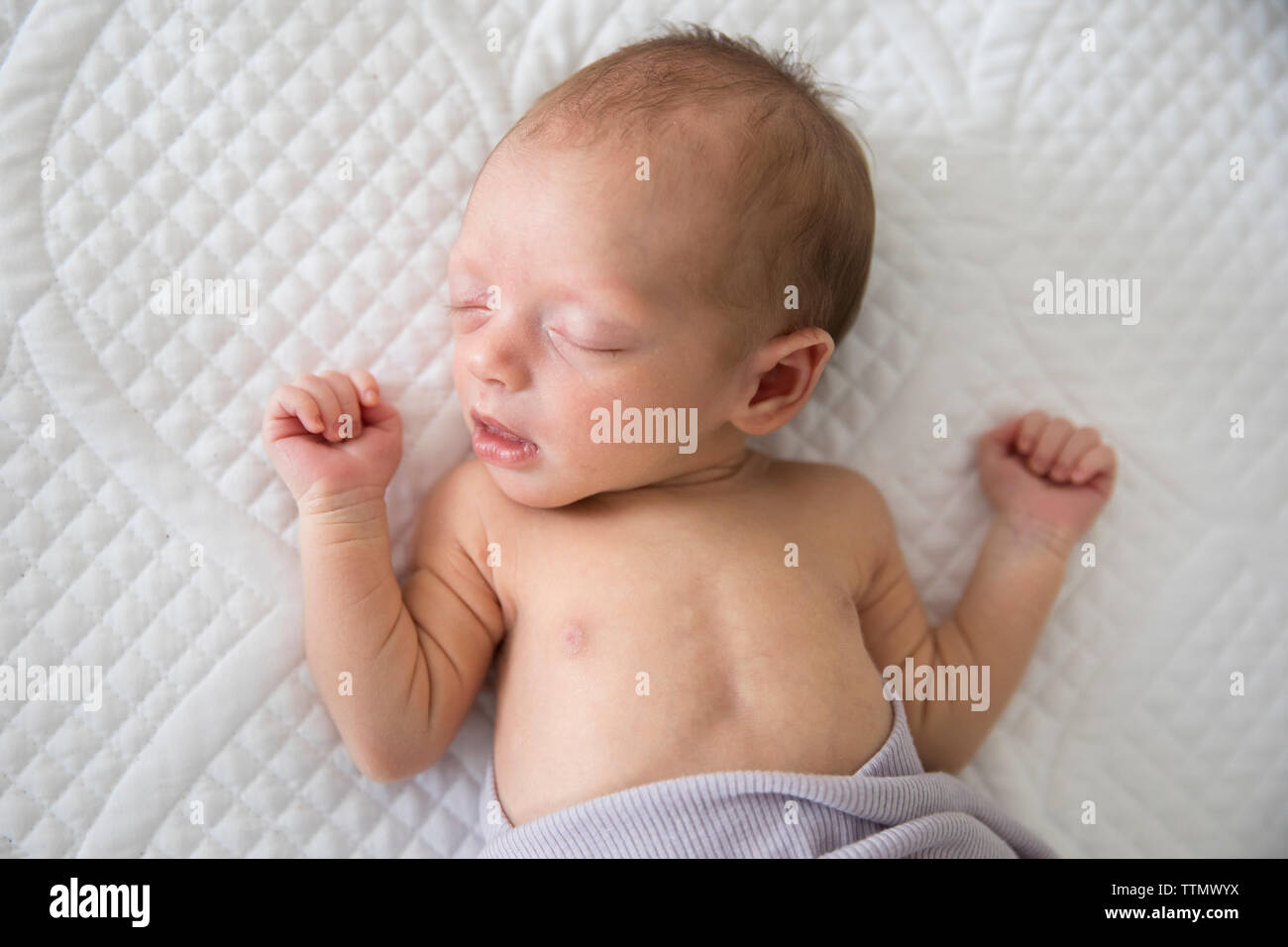 Overhead View of Sleeping Newborn Baby Girl Wrapped in Purple Blanket Stock Photo Alamy