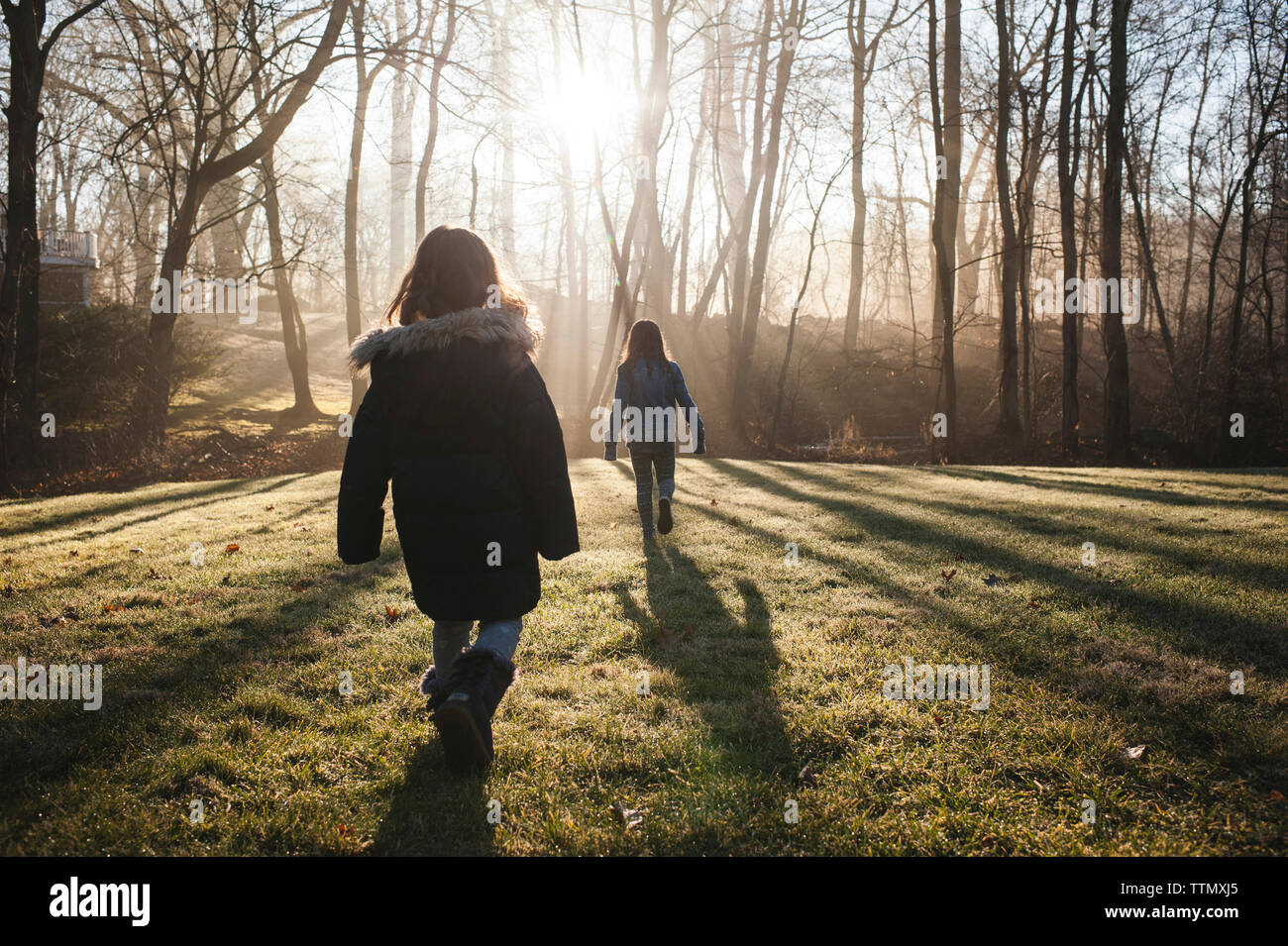 Rear view two girls walking hi-res stock photography and images - Alamy