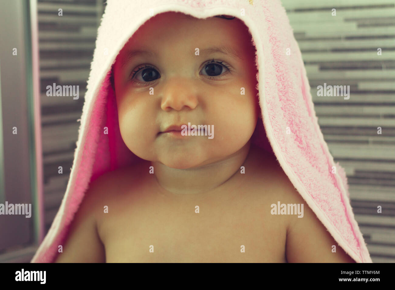 baby drying after a warm shower in her mom's arms Stock Photo Alamy