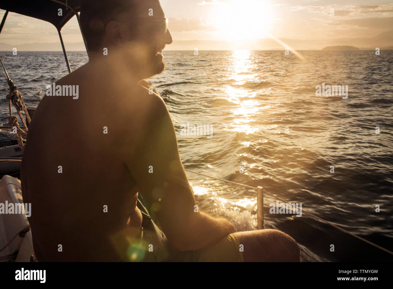 Sunset over boat on sea hi-res stock photography and images - Alamy