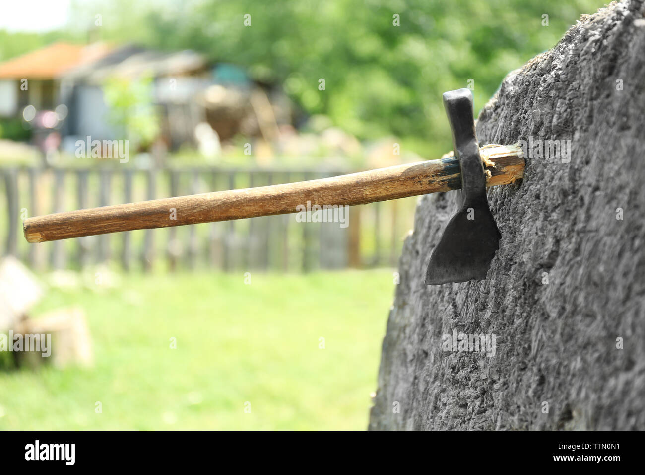 Axe stuck in log hi-res stock photography and images - Alamy