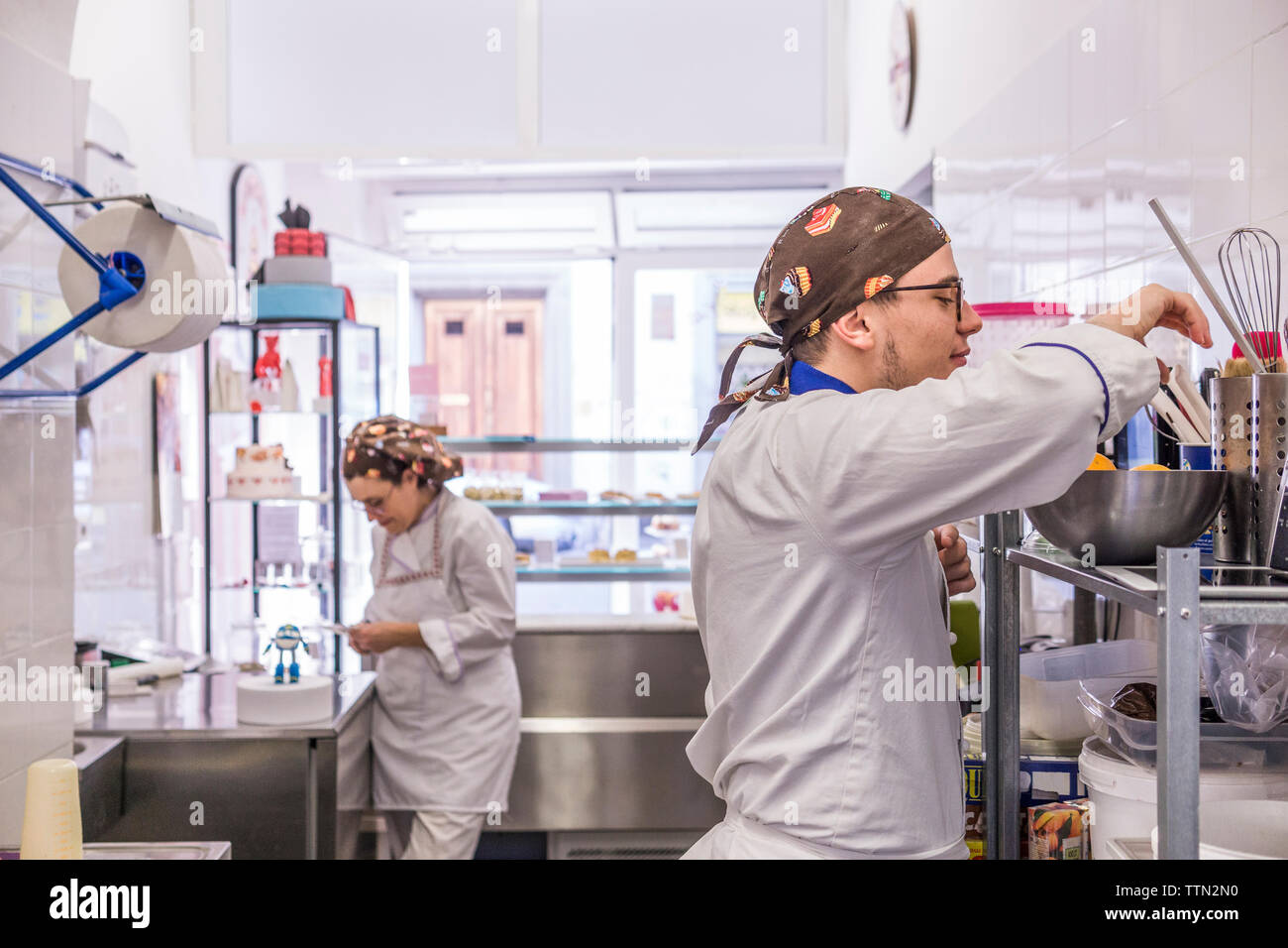 Bakers preparing food in kitchen at laboratory Stock Photo