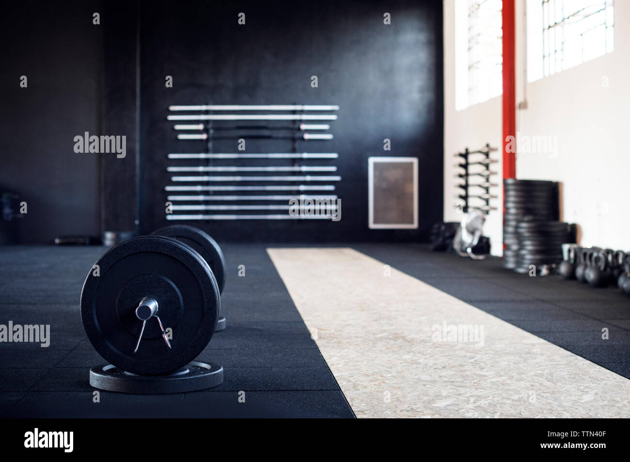 Barbell in gym Stock Photo Alamy