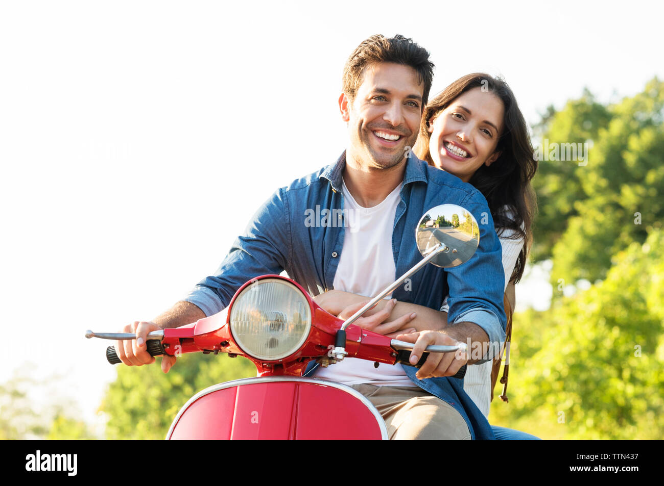 Happy man on scooter hi-res stock photography and images - Alamy