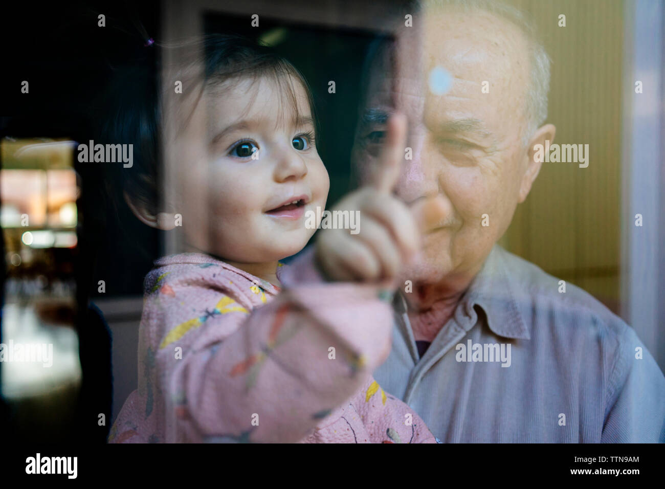 Granddaughter Touching Granddad