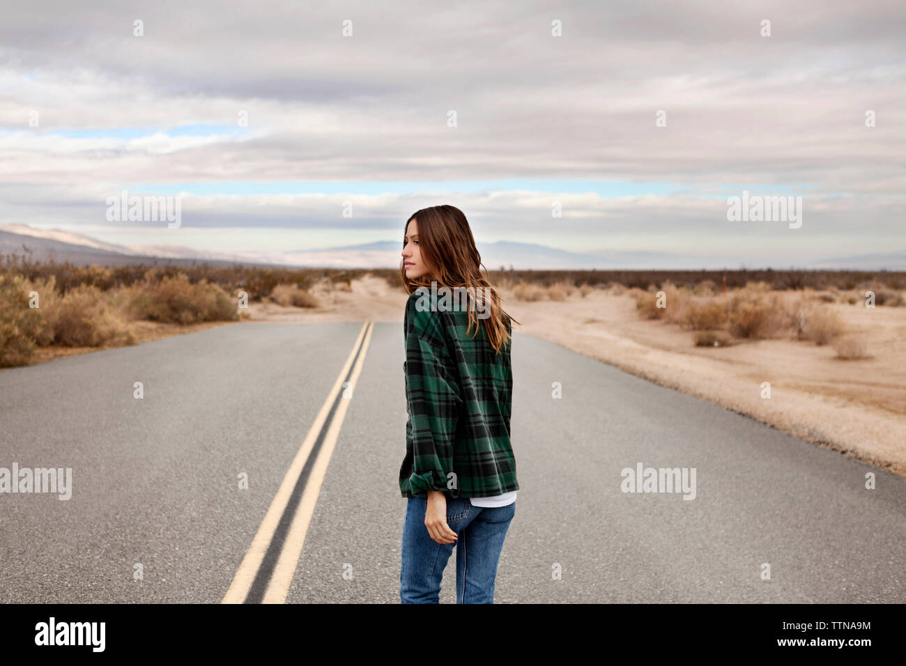 Woman walking on country road hi-res stock photography and images - Alamy