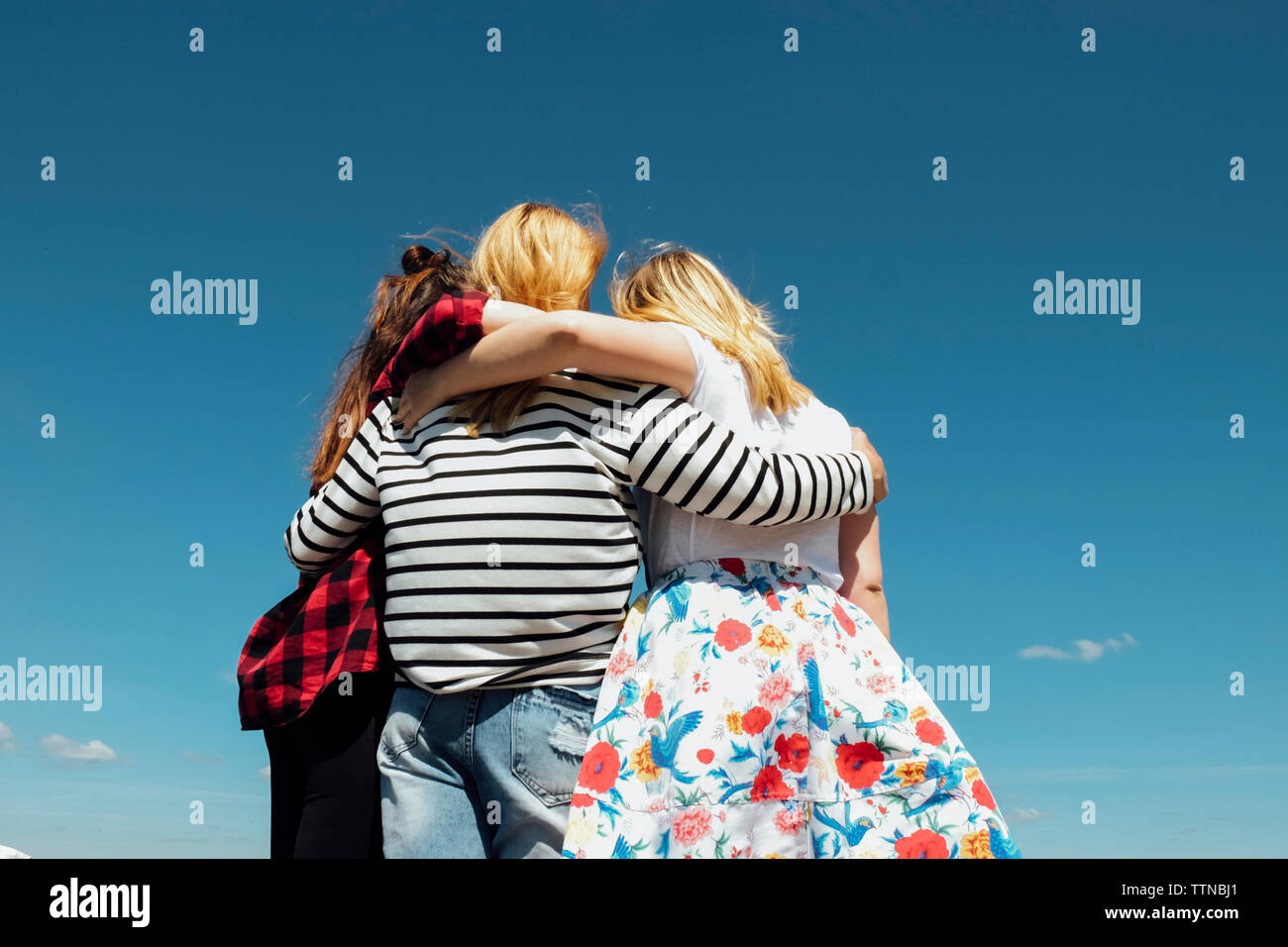 Women together arms embracing hi-res stock photography and images - Alamy