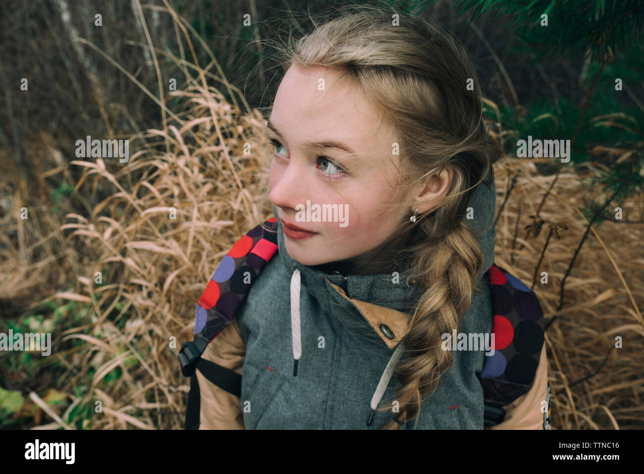 Girl with long Golden hair in tall grass Stock Photo - Alamy
