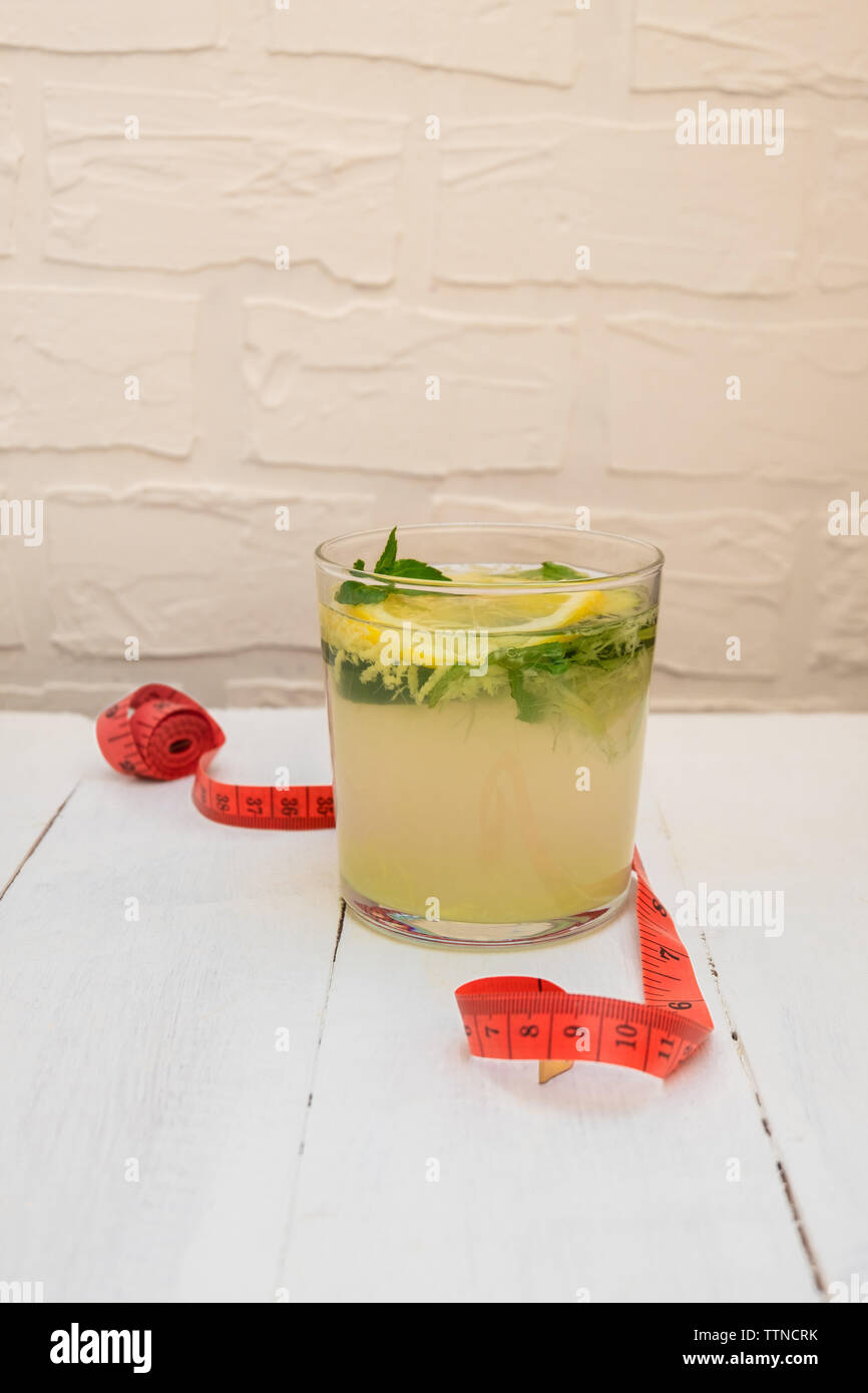 Glass of Detox Sassy Water with cucumber, lemon, ginger, mint for wieght loss Stock Photo