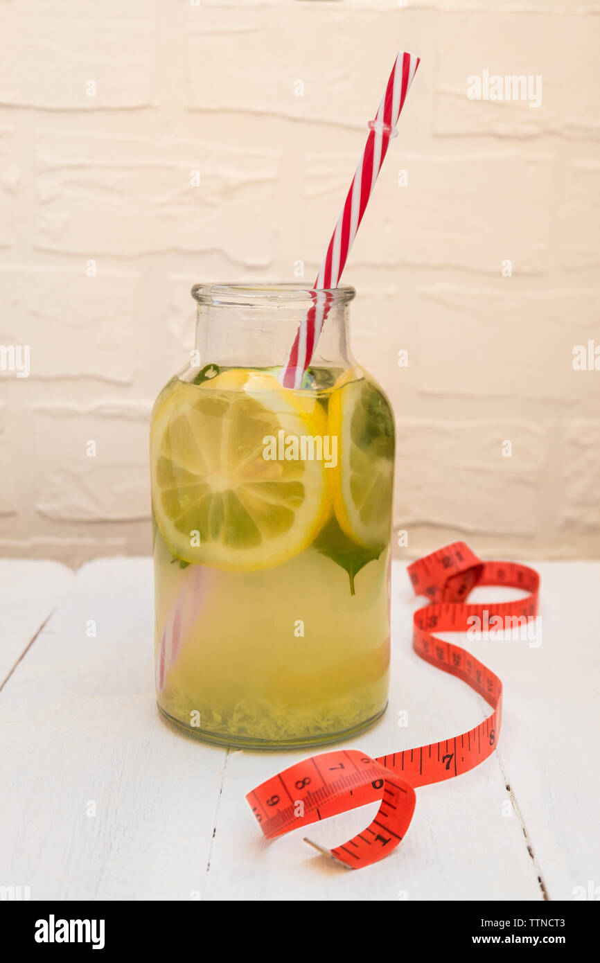 Detox water recipe of Sassy Water with lemon, cucumber, ginger, mint for weight loss Stock Photo