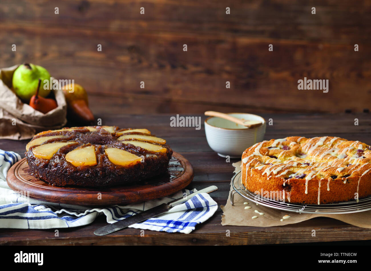 Close-up of homemade desserts with pears on table at home Stock Photo