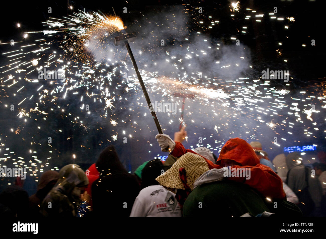 People exploding firework during festival at night Stock Photo - Alamy