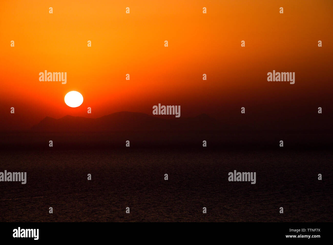 Majestic view of sea against dramatic sky during sunset Stock Photo - Alamy