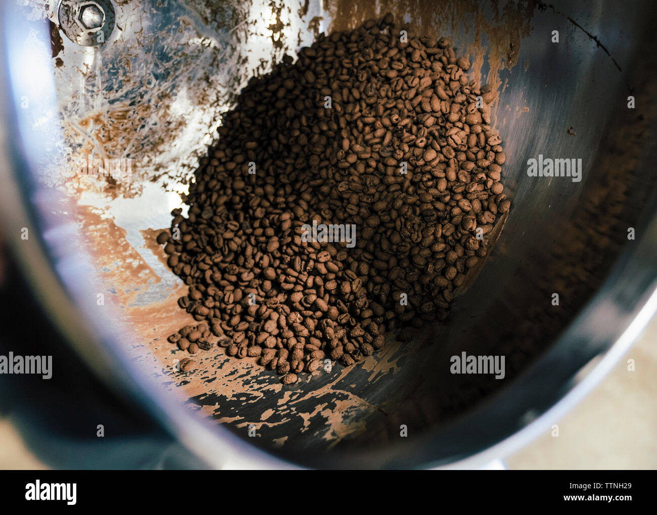 Cocoa beans in machinery at chocolate factory Stock Photo Alamy