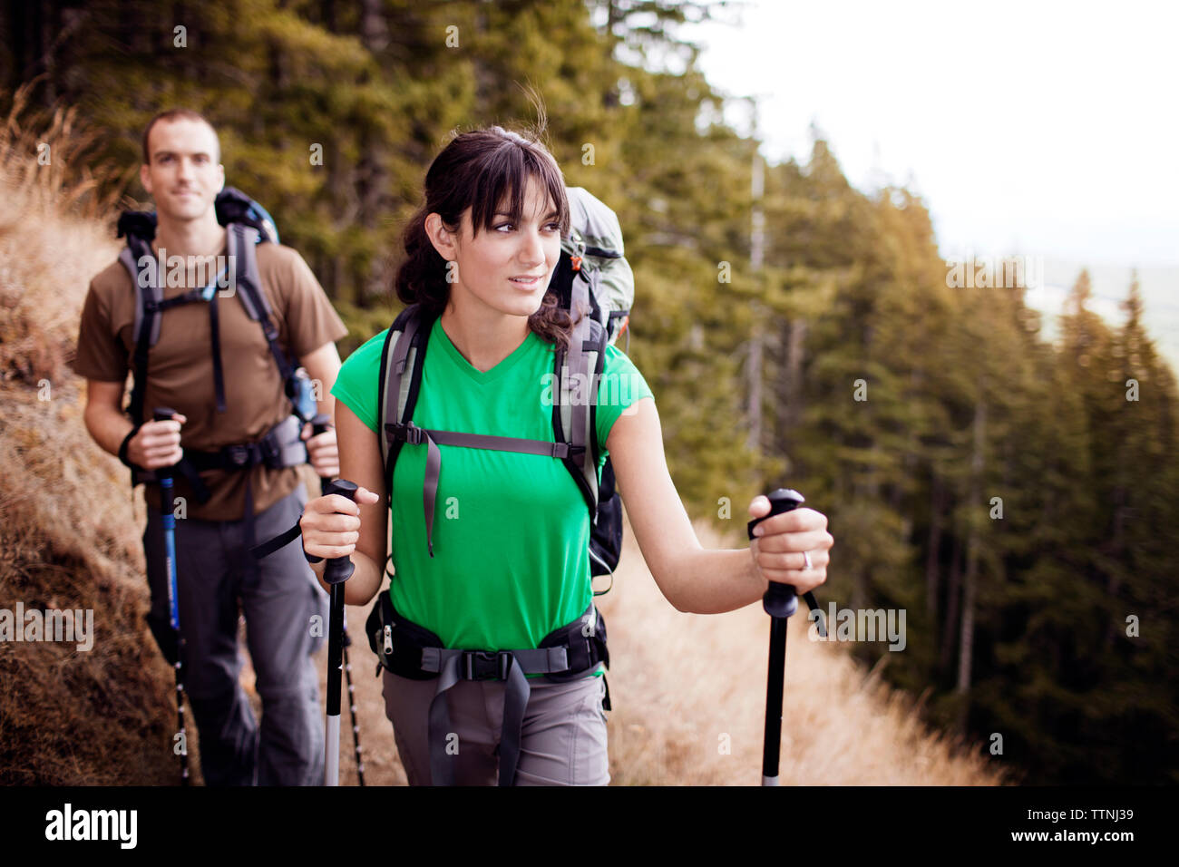 Couple holding hiking poles hi-res stock photography and images - Alamy