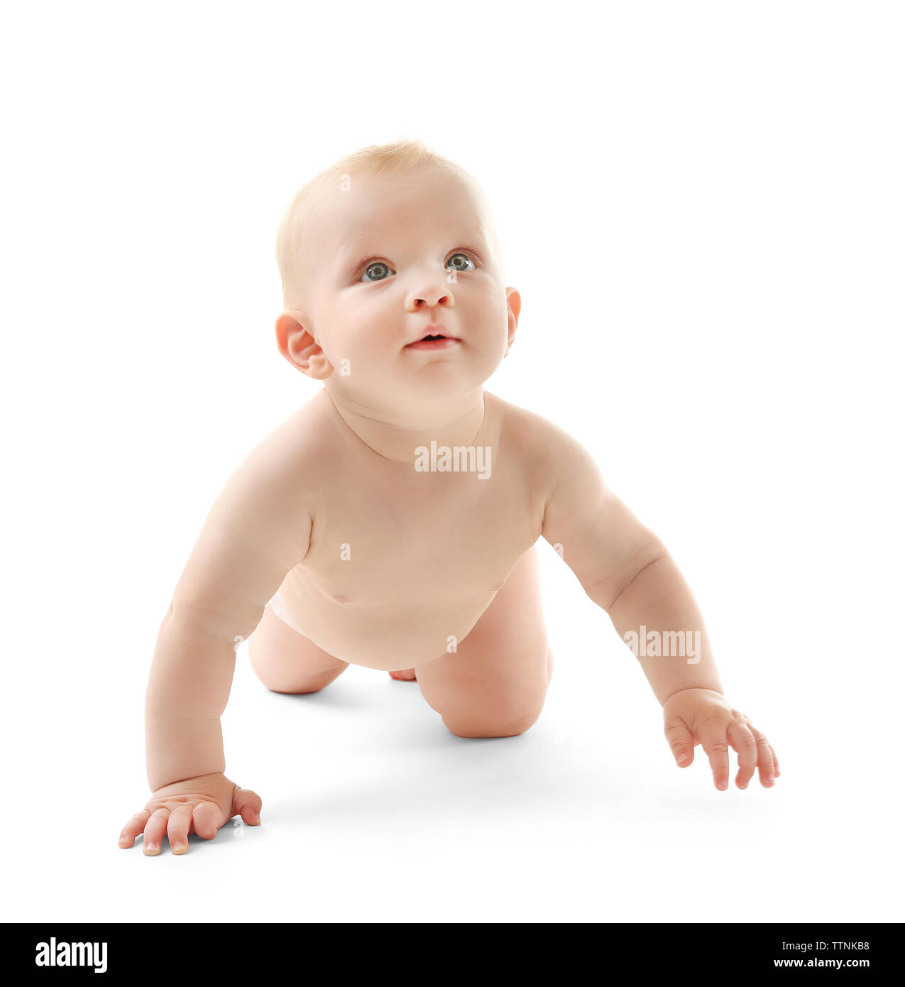 Baby crawling on white background Stock Photo - Alamy