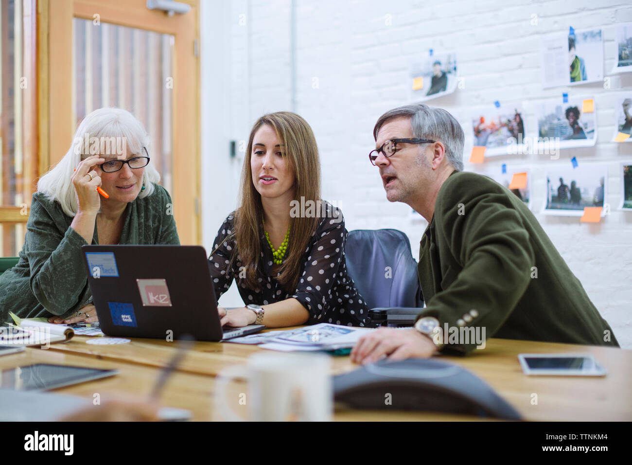 business people doing research on laptop computer in meeting room Stock ...