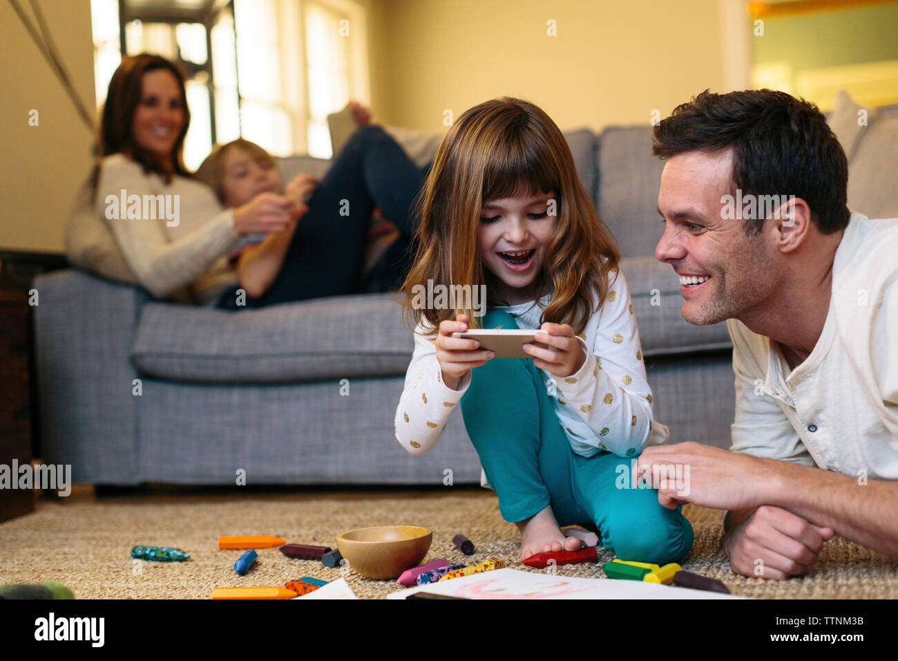 Happy parents with children at home Stock Photo