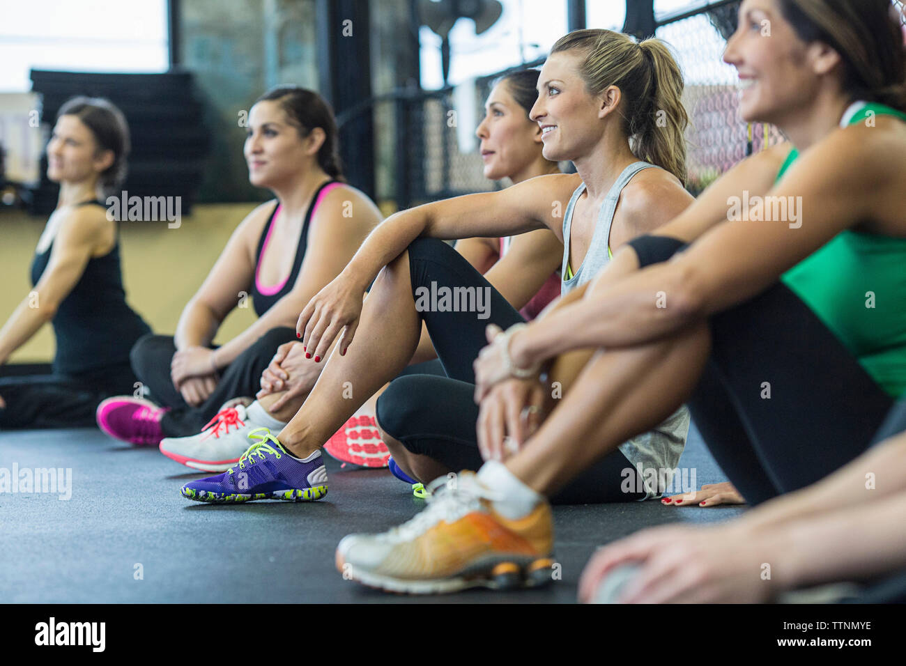Tired women relaxing in gym Stock Photo