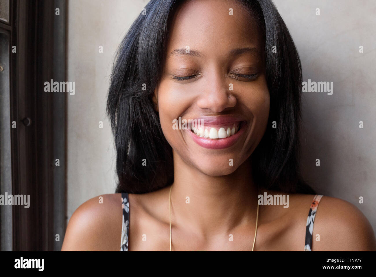 Happy woman with eyes closed Stock Photo