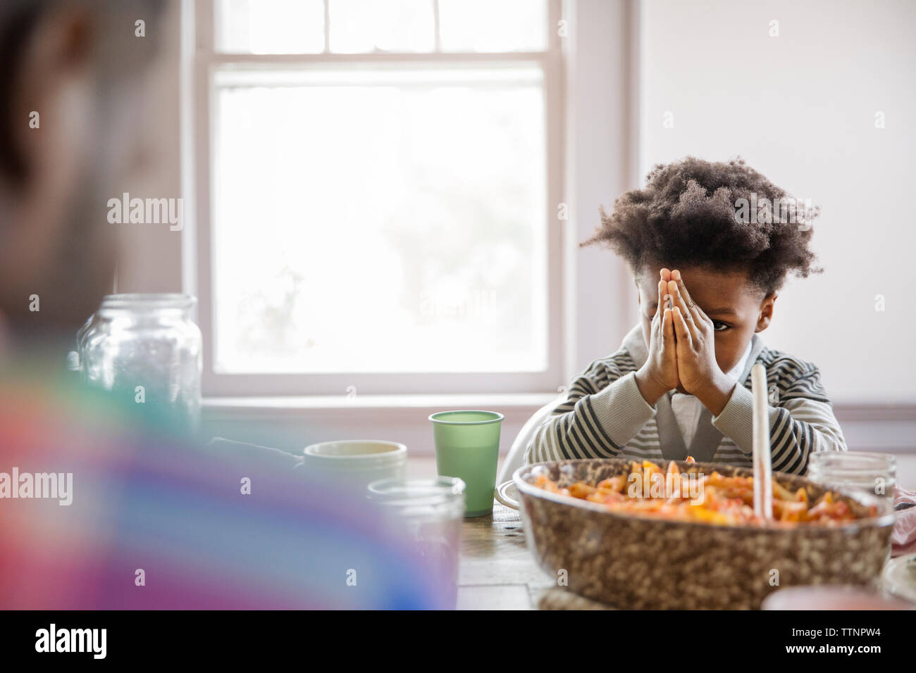 Boy praying table hi-res stock photography and images - Alamy