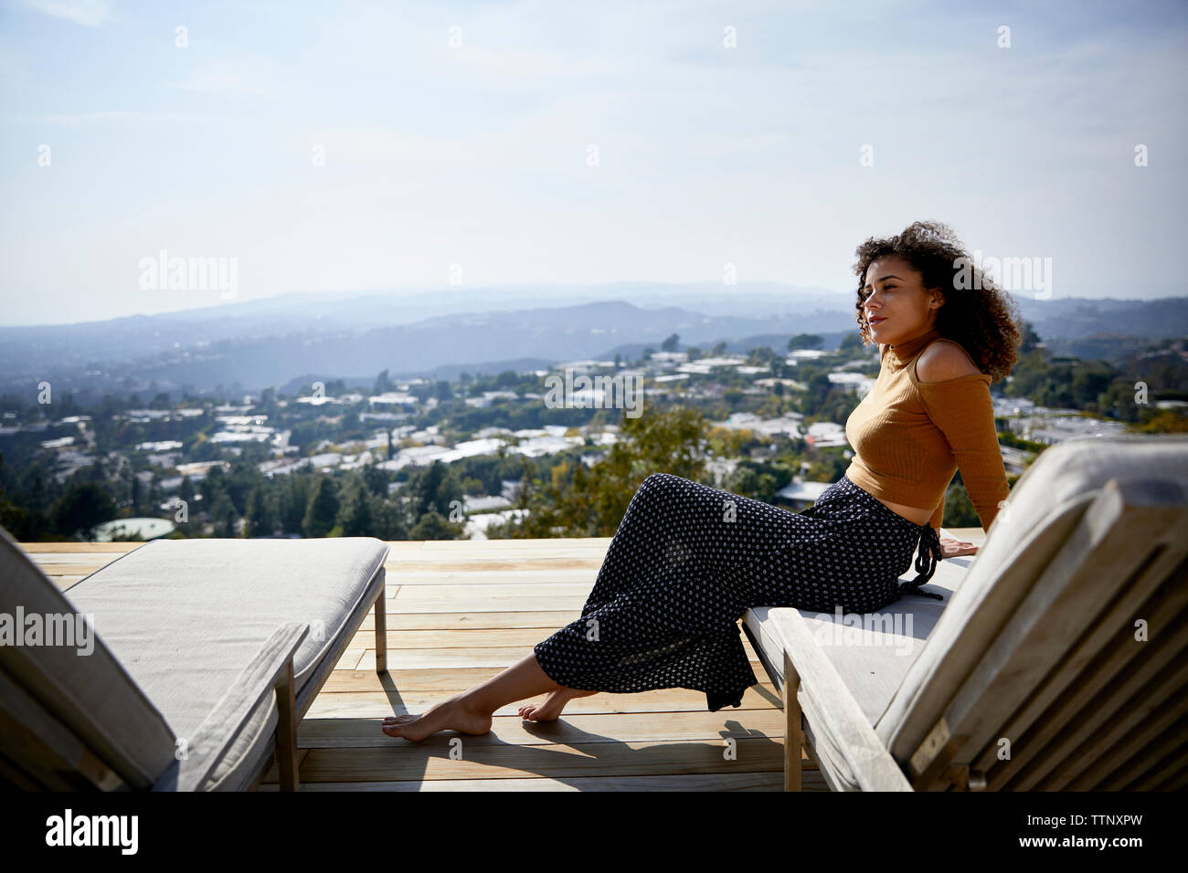 African woman side view sitting hi-res stock photography and images - Alamy