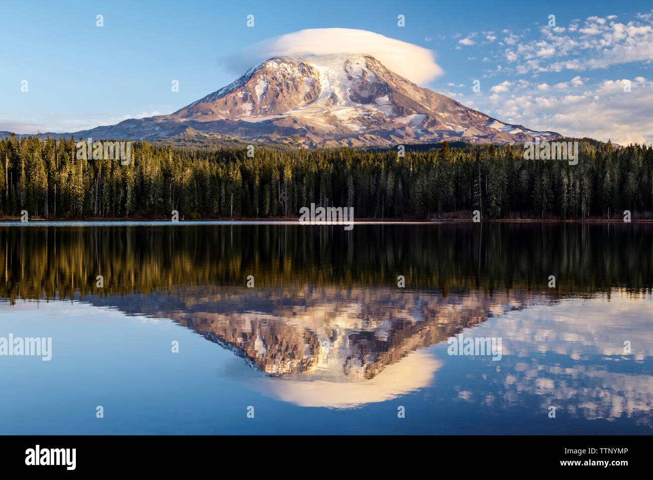 Scenic view of Mount Rainier and lake against sky Stock Photo