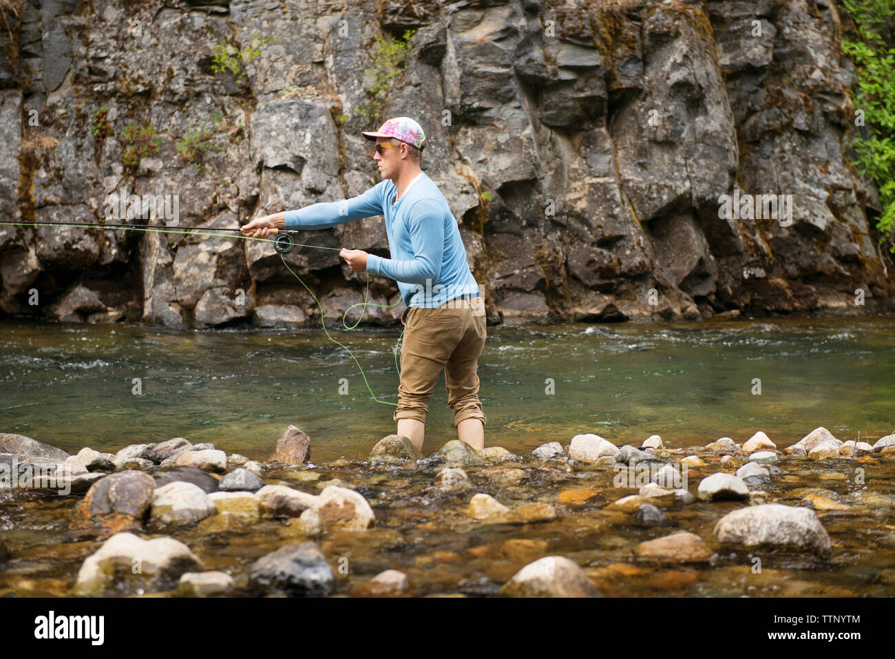 Fishing from the stones hi-res stock photography and images - Alamy