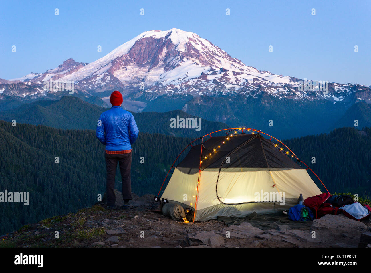 Portrait of Hiker with backpacking tent and Mt Rainier Stock Photo