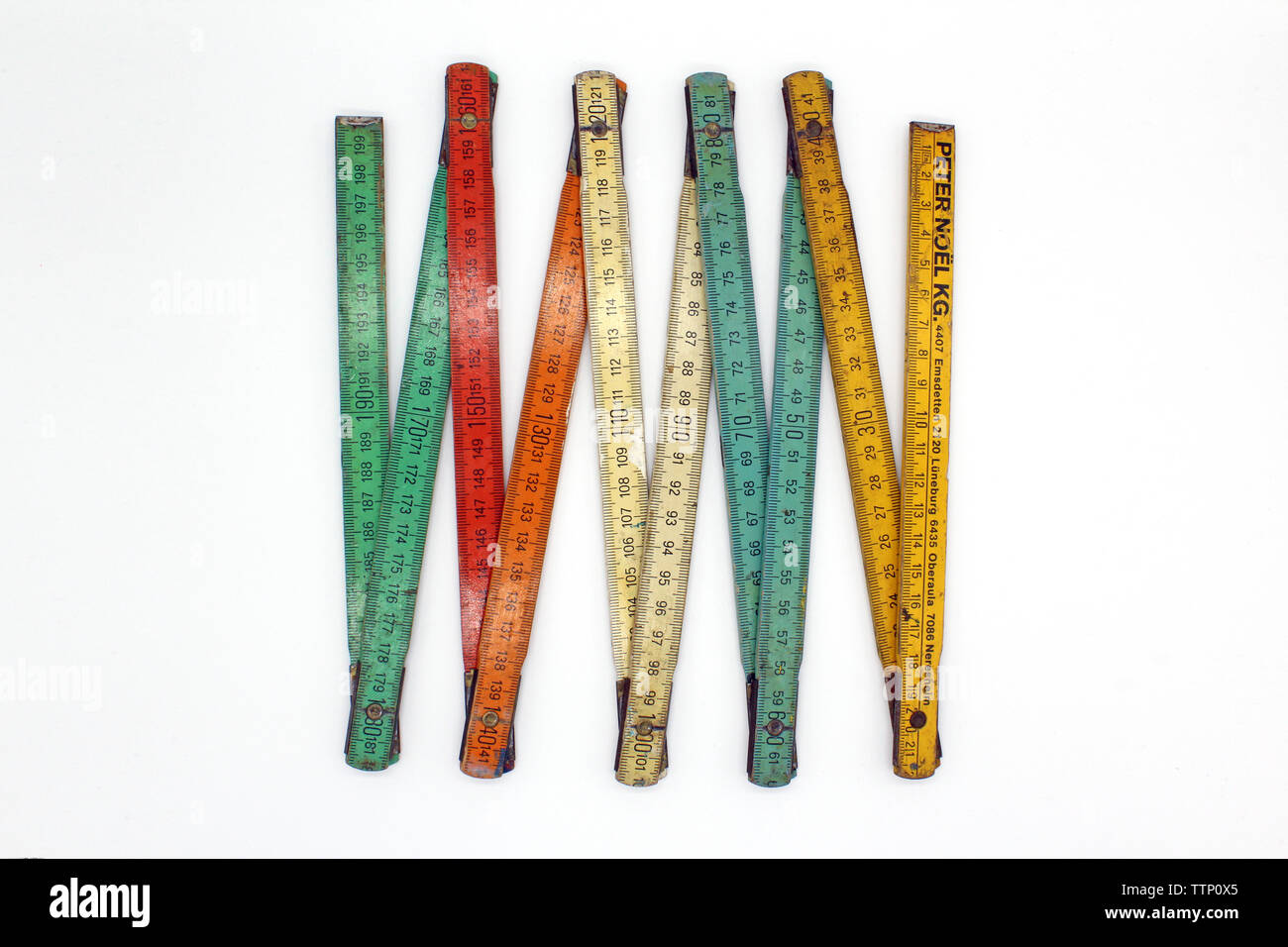 Vintage multi color wooden meter stick isolated on a white background