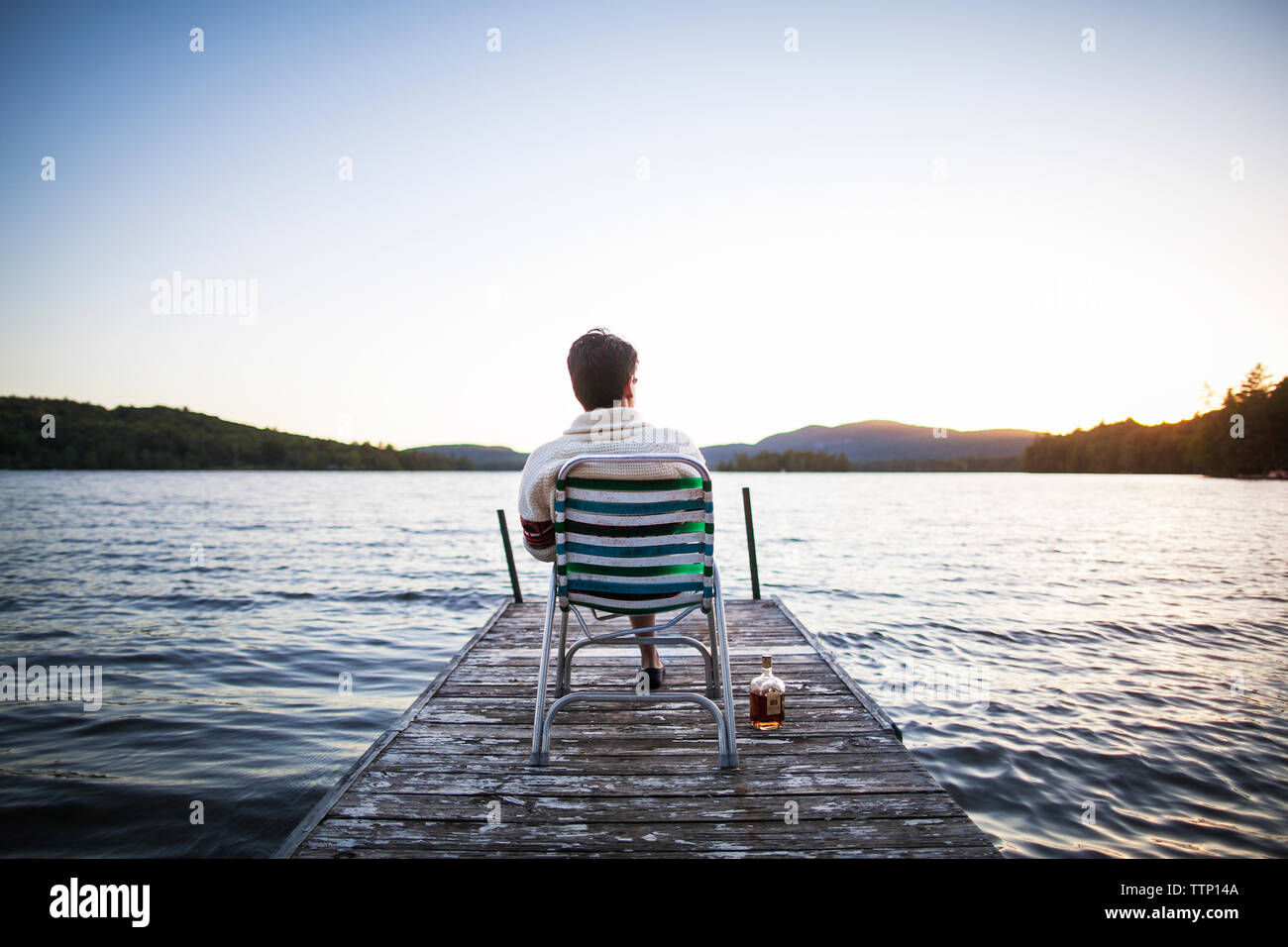 Man sitting chair and rear view hi-res stock photography and images - Alamy