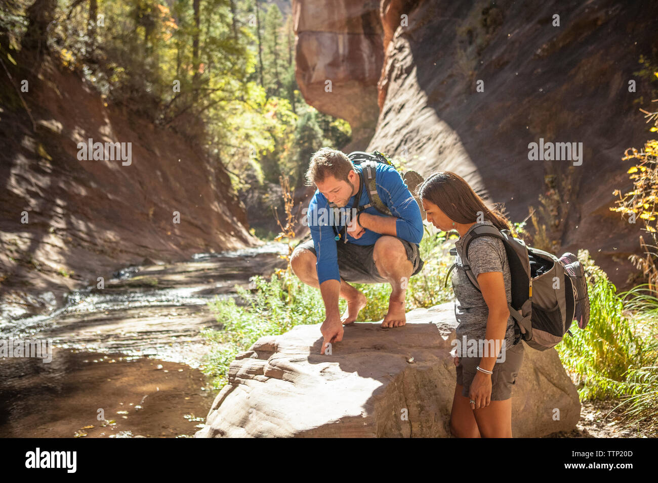 Examing Rocks Together Man examining rocks hi-res stock photography and images - Alamy