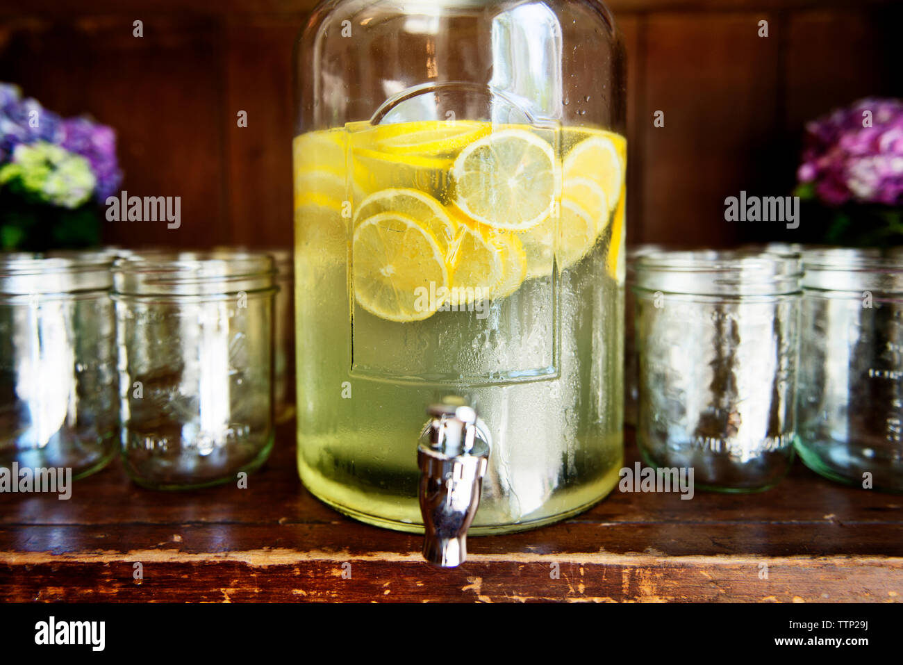 Fresh lemonade in glass jar on table Stock Photo