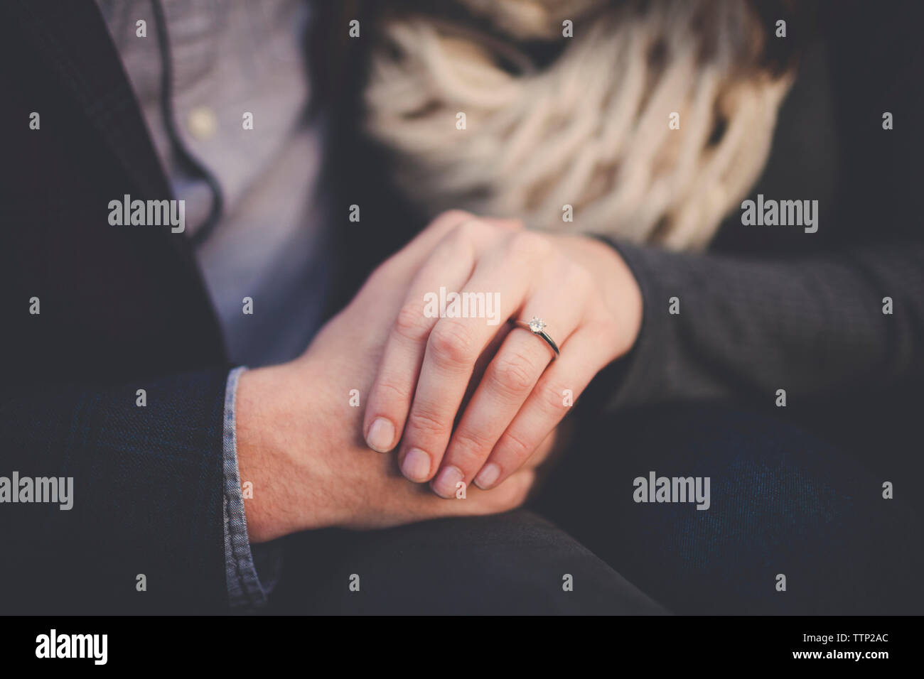 Smart couple holding hands hi-res stock photography and images - Alamy