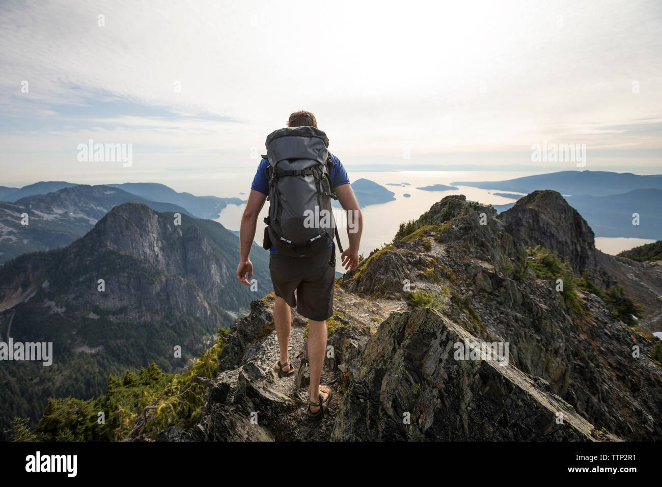 Young hiker backpack walking hi-res stock photography and images - Alamy
