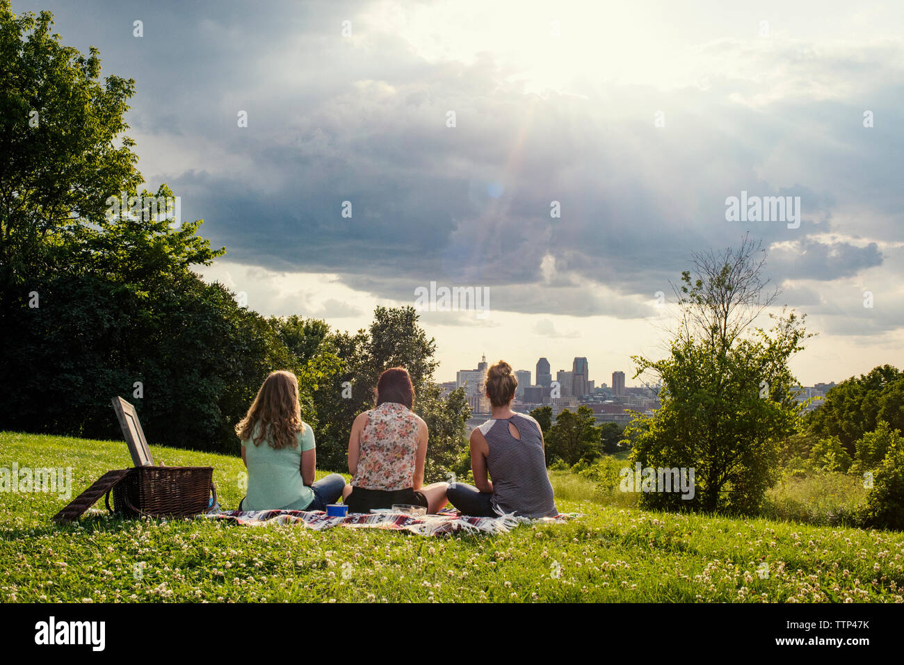 Friends three females rear view hi-res stock photography and images - Alamy