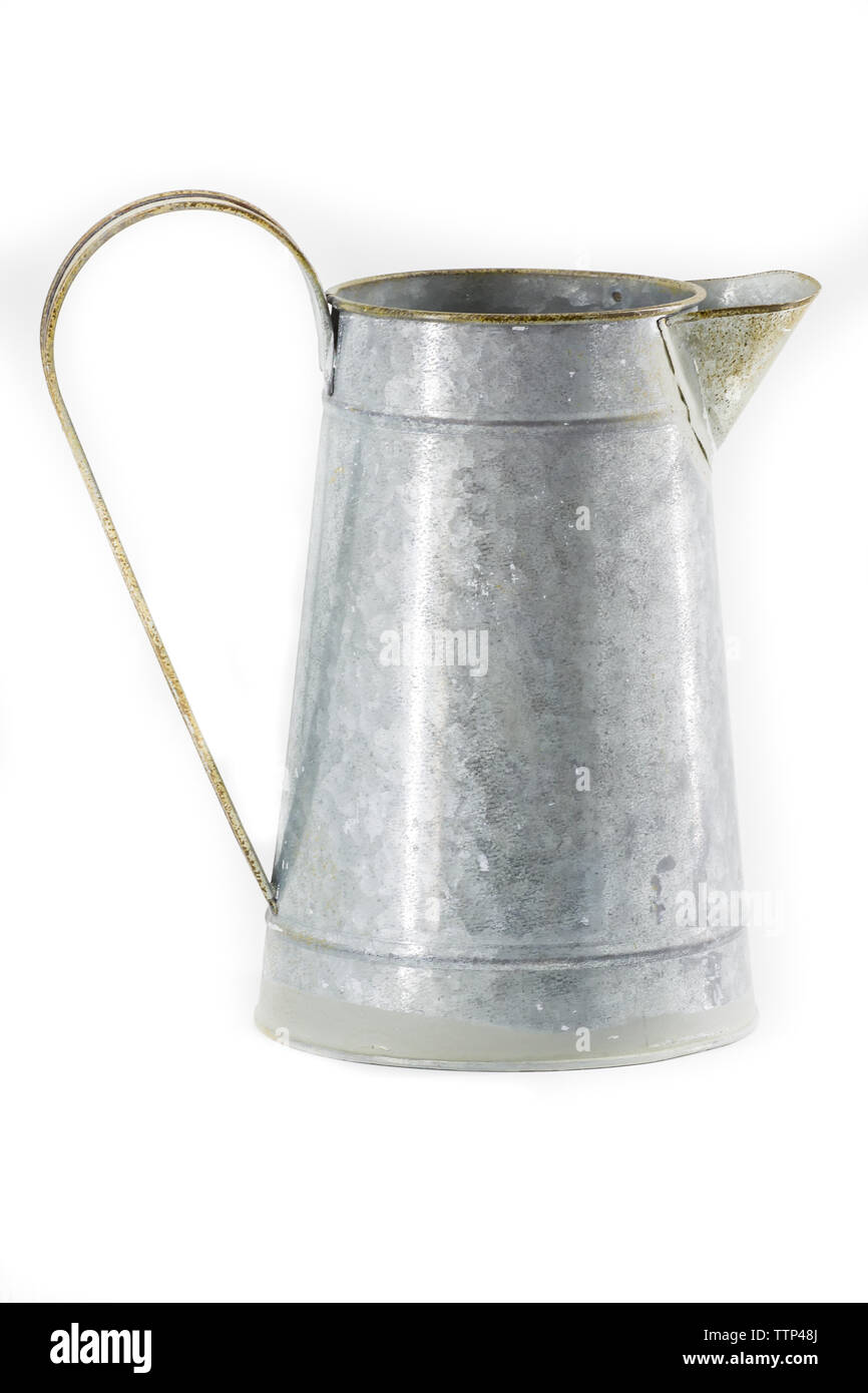 An old galvanized pitcher on a white background Stock Photo
