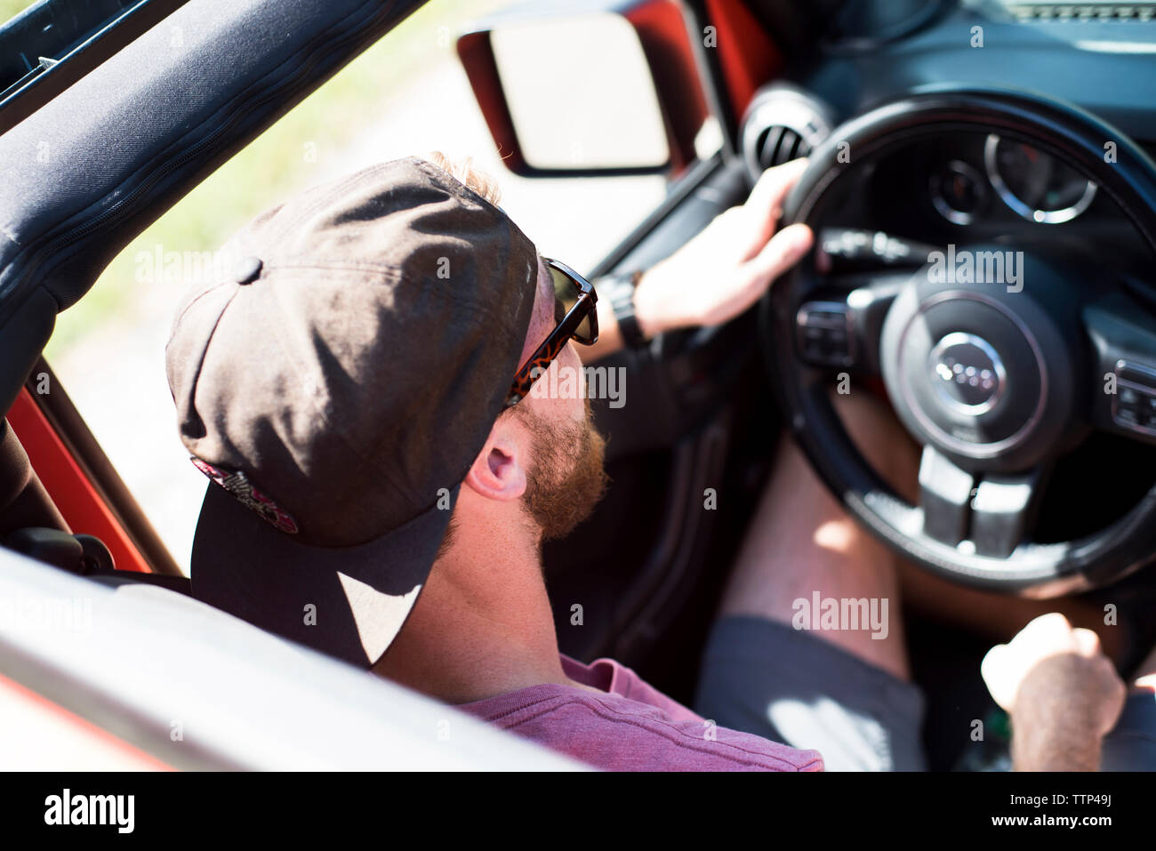 Young man driving vehicle hi-res stock photography and images - Alamy
